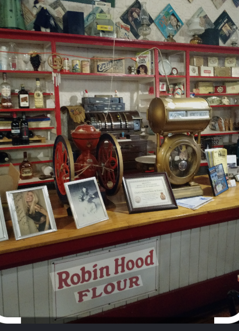 Antique scale, brass cash register and Robin Hood Flour sign at Clark's counter