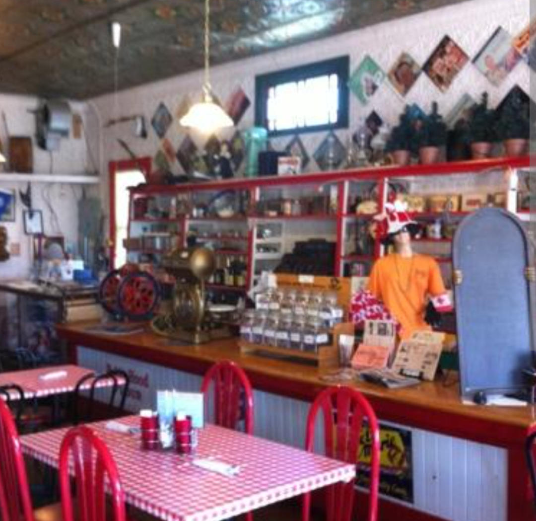 Inside Clark's with red checkered tables and vintage counter display